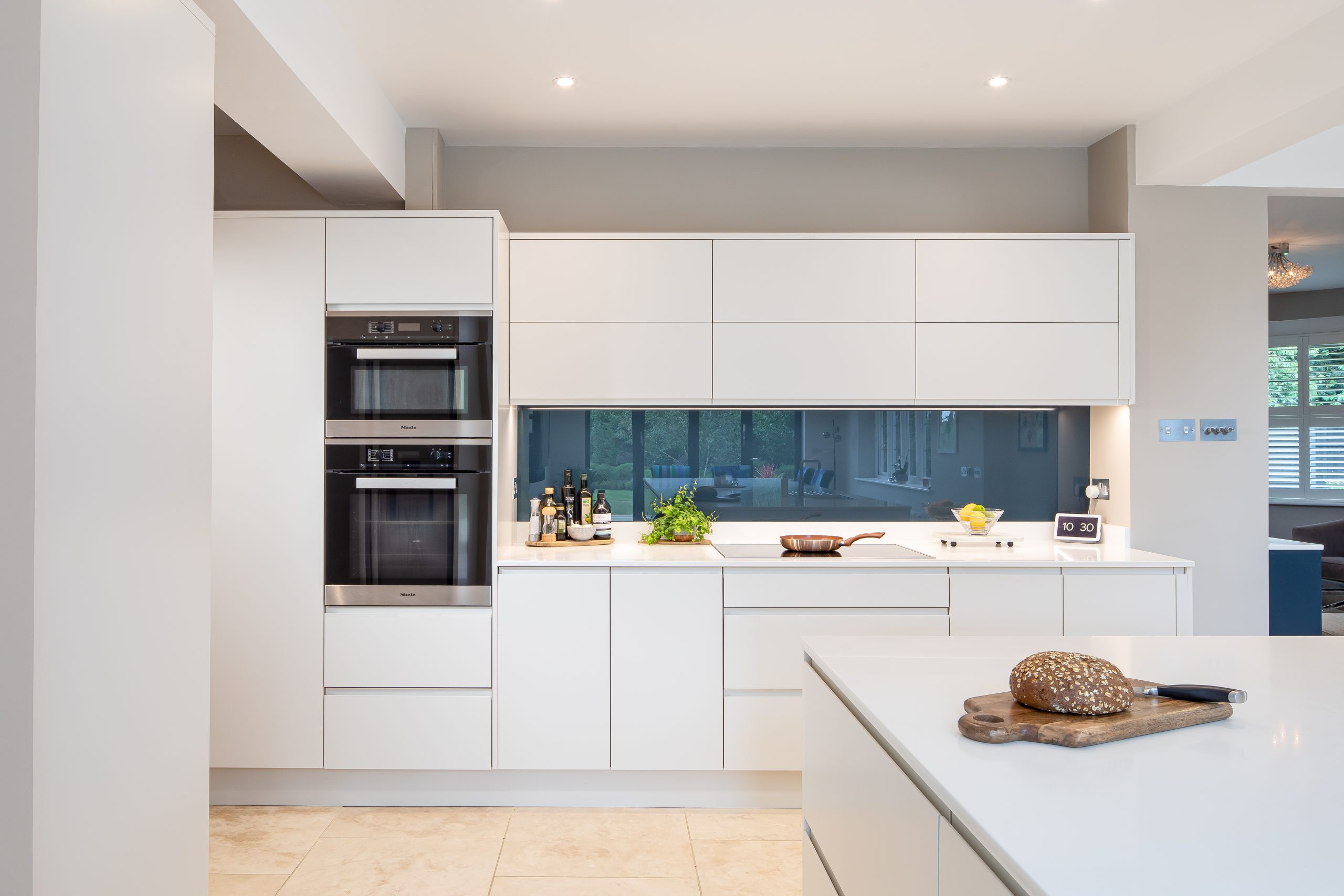 John Lewis of Hungerford pure kitchen in white and black splashback
