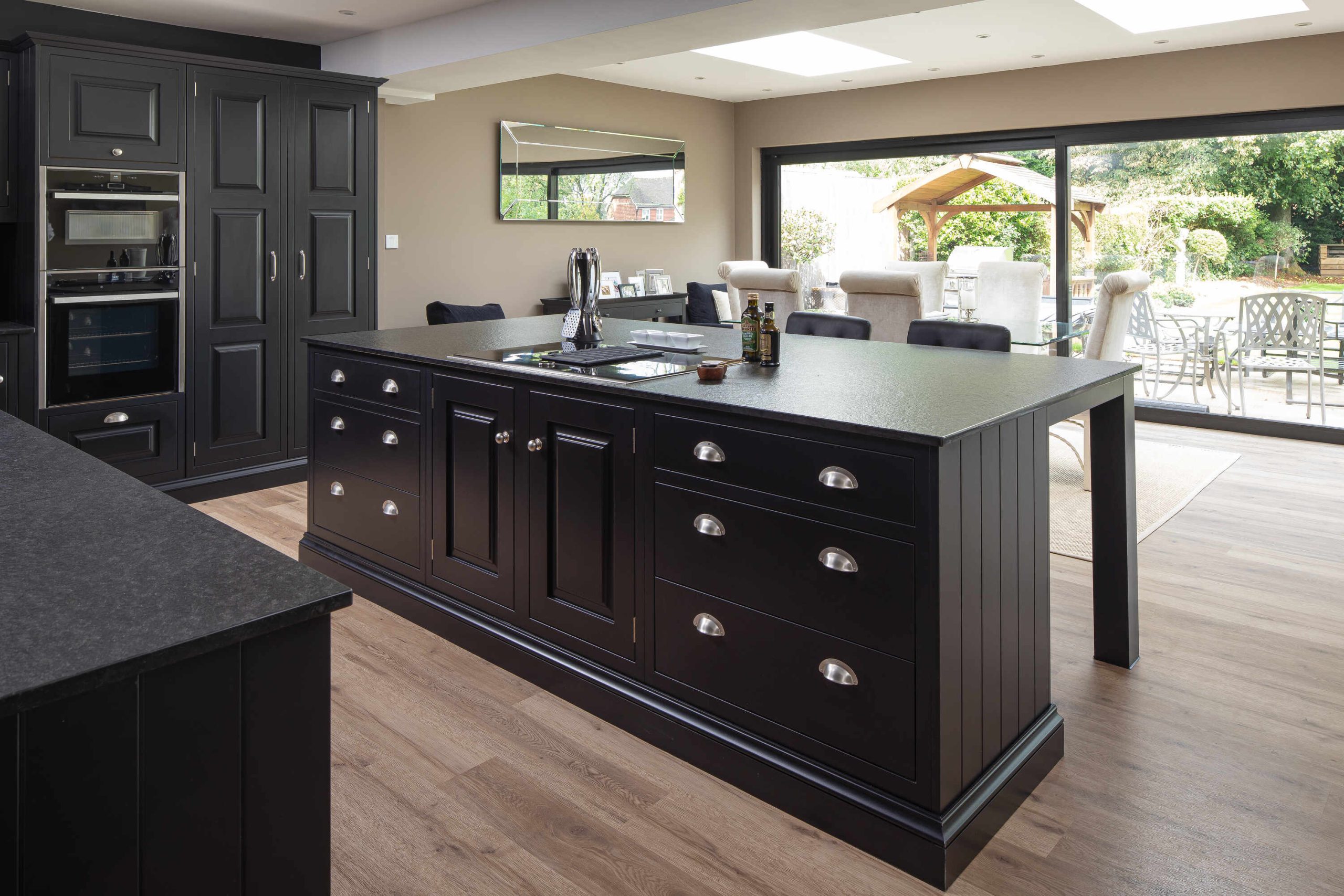 Artisan Kitchen With Black Island And Shaker Cabinets