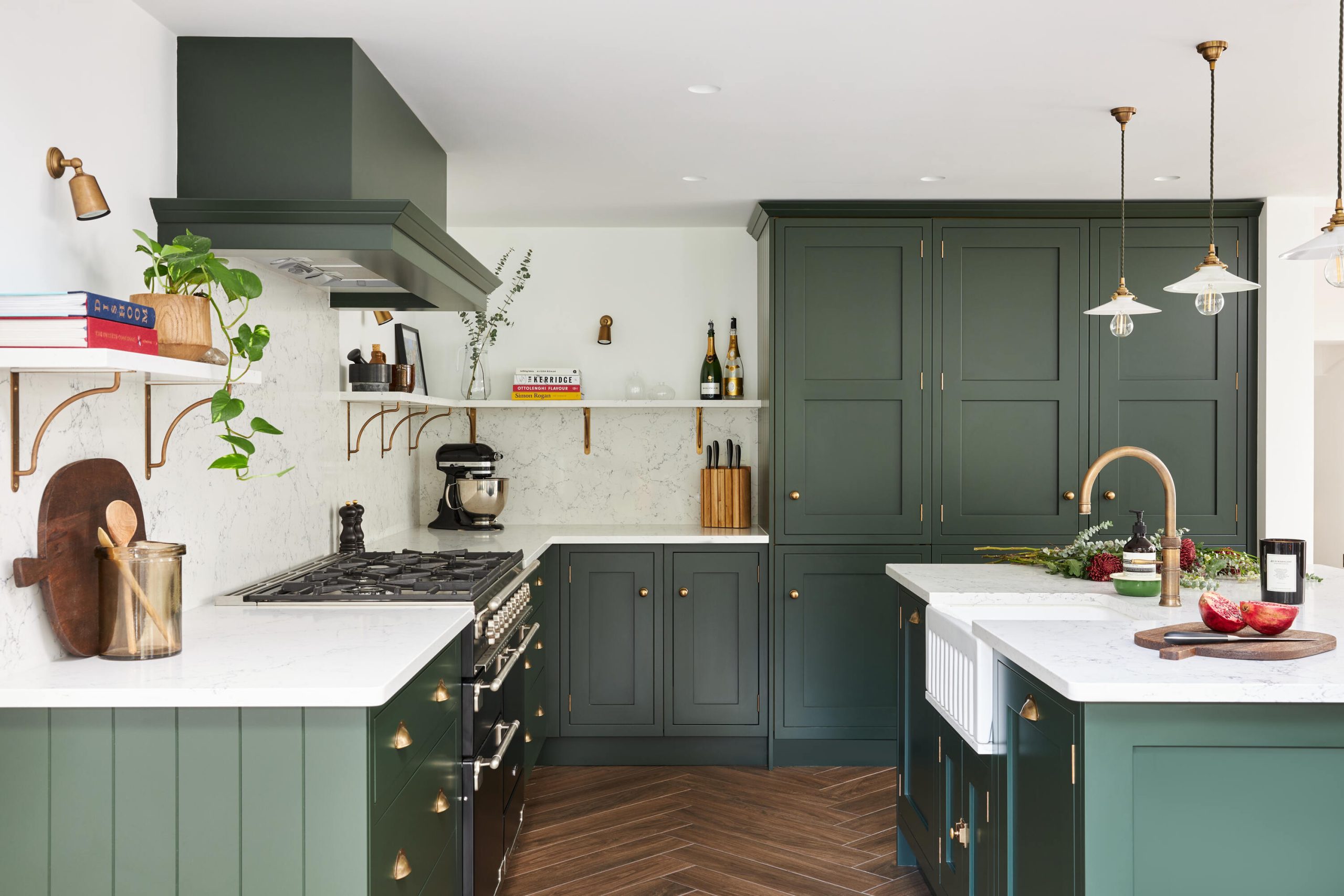 Shaker Kitchen With Dark Green Cabinets And Brass Accents