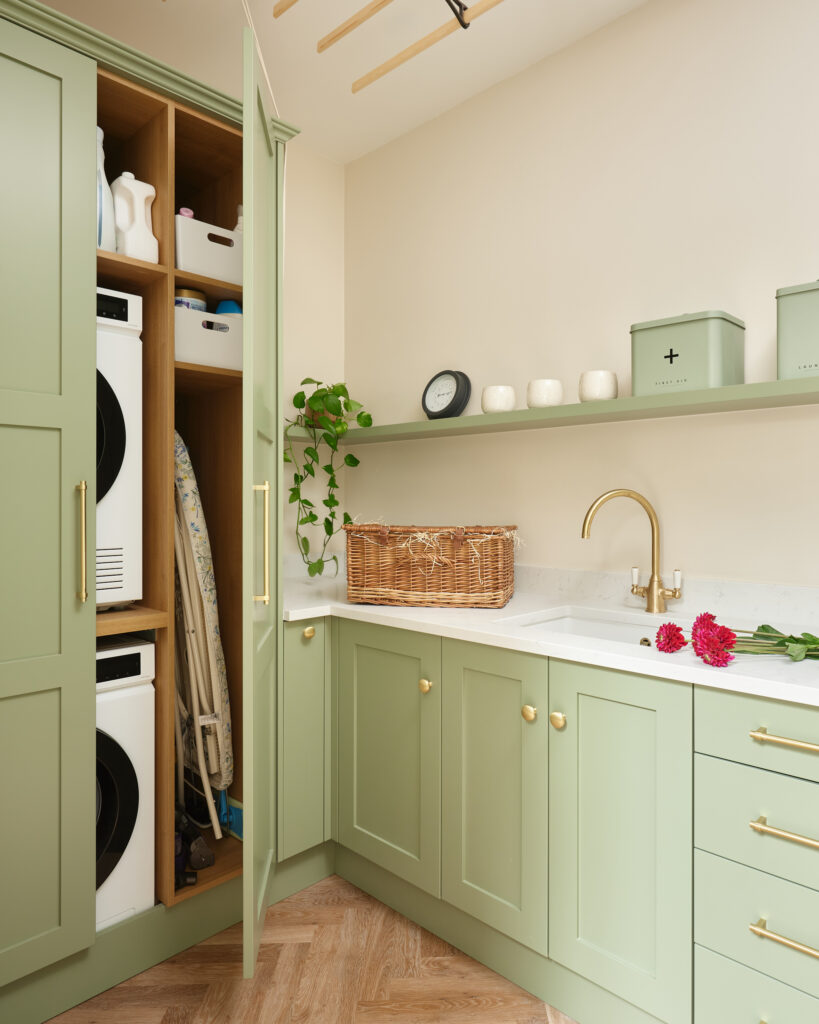 Bespoke green utilty room with hidden appliances